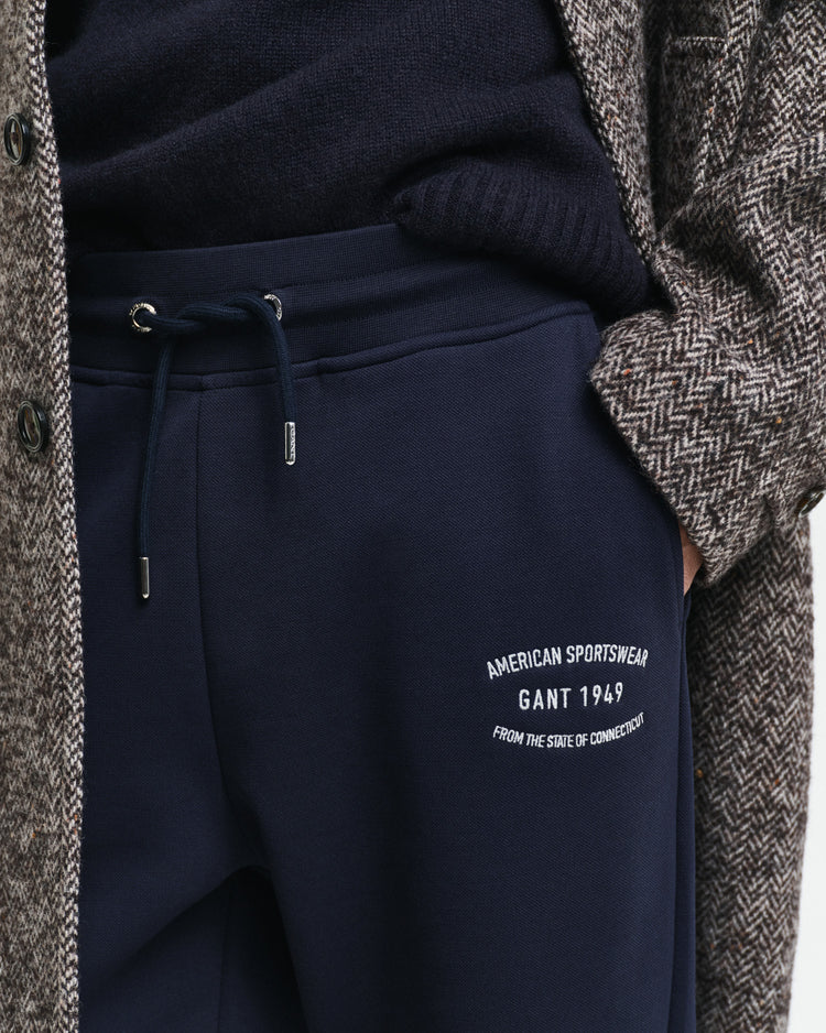 Spodnie dresowe męskie z nadrukiem regular fit granatowe