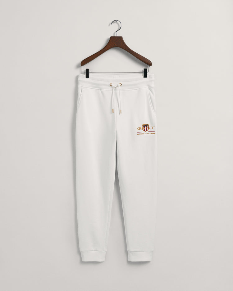 Spodnie dresowe męskie z nadrukiem regular fit kremowe