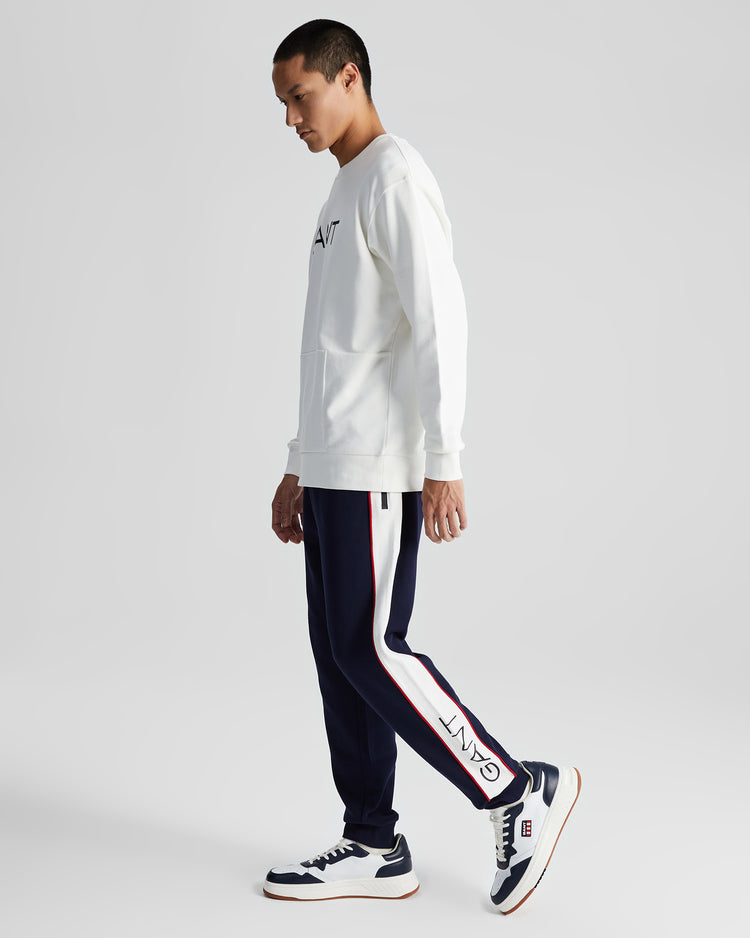 Bawełniane spodnie dresowe męskie z nadrukiem regular fit białe