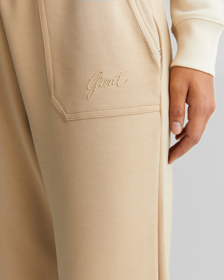 Spodnie dresowe damskie z nadrukiem regular fit beżowe