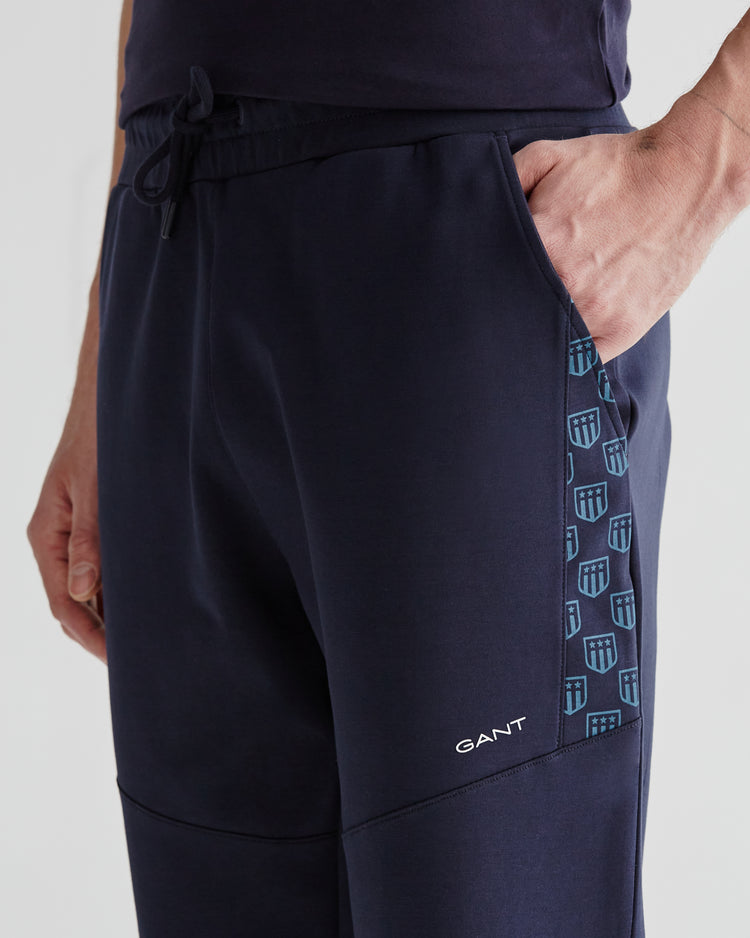 Spodnie dresowe męskie z nadrukiem regular fit granatowe
