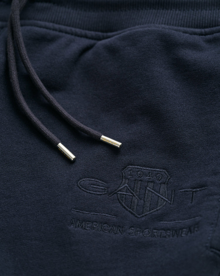 Bawełniane spodnie dresowe męskie z nadrukiem regular fit granatowe