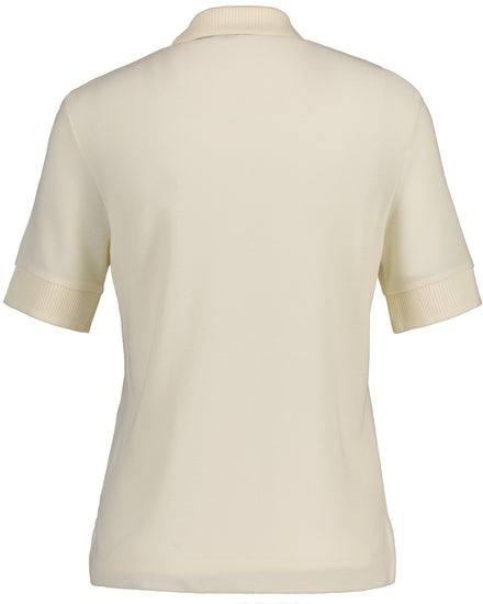 Polo damskie beżowe o luźnym kroju z logo