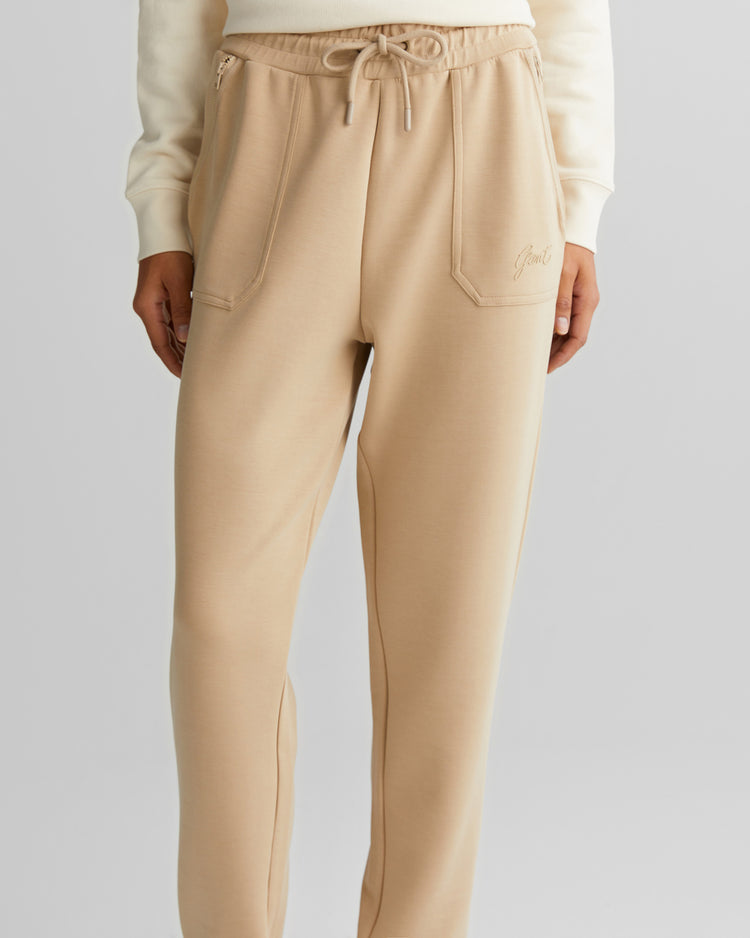Spodnie dresowe damskie z nadrukiem regular fit beżowe