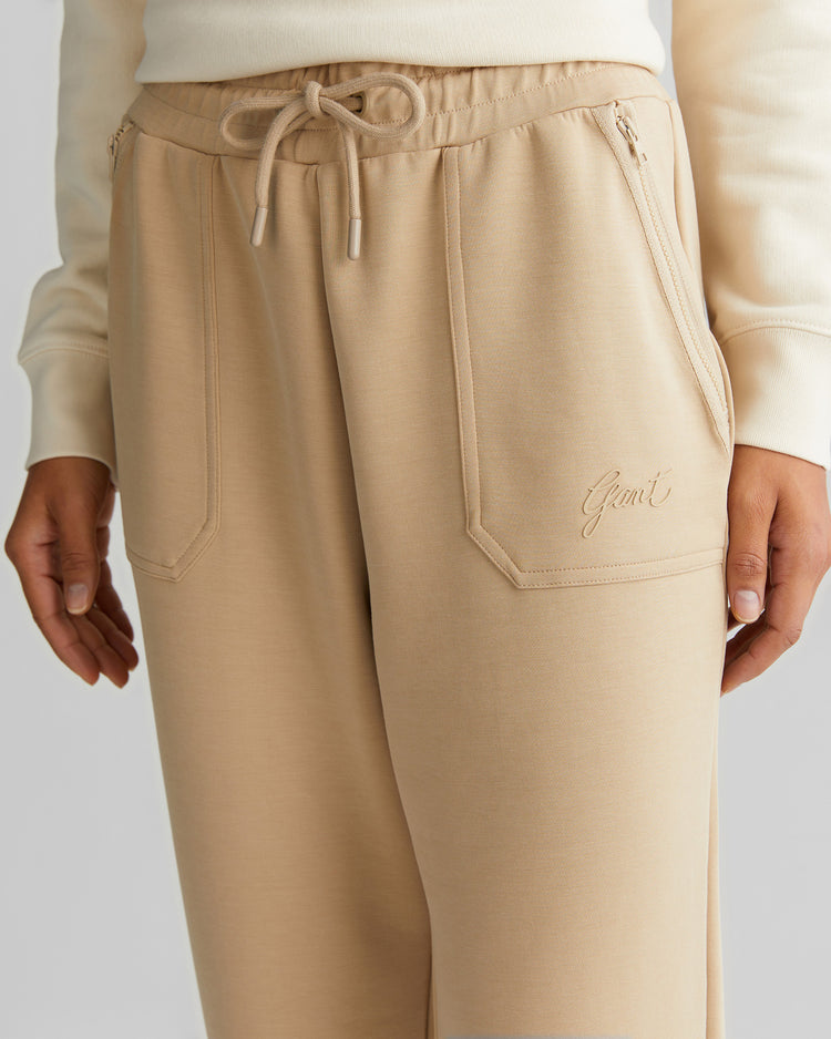 Spodnie dresowe damskie z nadrukiem regular fit beżowe
